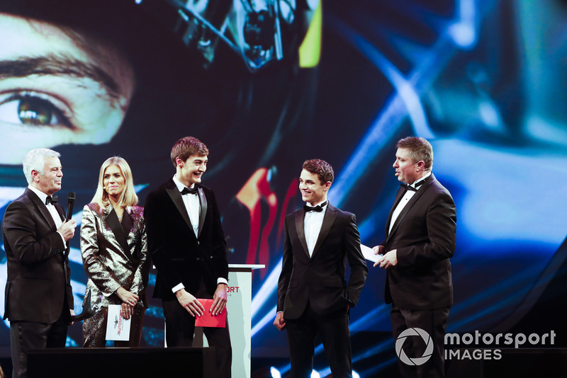 Williams F1 Driver George Russell, and McLaren F1 driver Lando Norris on stage to present the National Racing Driver Award to Dan Ticktum, accepted on his behalf by Derek Warwick