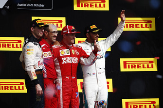 Kimi Raikkonen, Ferrari, celebrates on the podium after winning the race with Max Verstappen, Red Bull Racing, Carlos Santi, Race Engineer, Ferrari, and Lewis Hamilton, Mercedes AMG F1