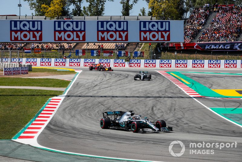 Lewis Hamilton, Mercedes AMG F1 W10, leads Valtteri Bottas, Mercedes AMG W10, and Max Verstappen, Red Bull Racing RB15