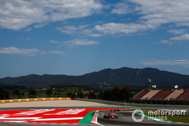 Sebastian Vettel, Ferrari SF90, Carlos Sainz Jr., McLaren MCL34
