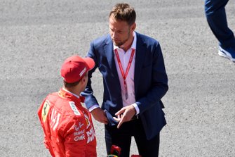 Sebastian Vettel, Ferrari, talks to Jenson Button, Sky Sports F1, after Qualifying