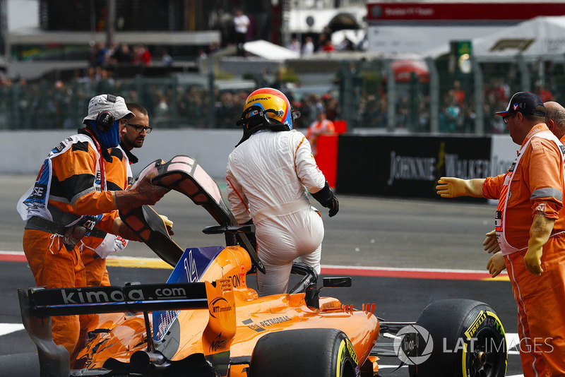 Fernando Alonso, McLaren MCL33, exits his car after crashing over Charles Leclerc, Sauber C37, following contact from Nico Hulkenberg, Renault Sport F1 Team R.S. 18, at the start