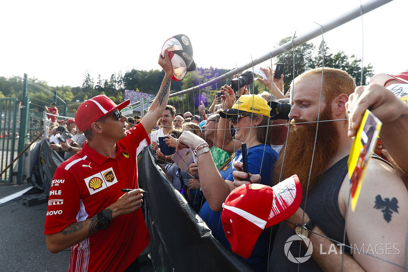 Kimi Raikkonen, Ferrari, signs autographs for fans