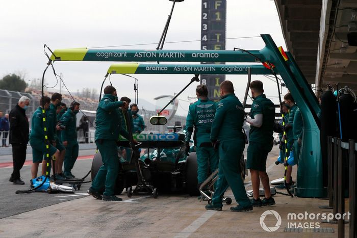 Sebastian Vettel, Aston Martin AMR22, in the pit lane