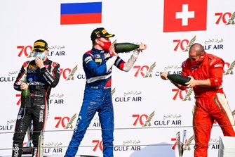 Louis Deletraz, Charouz Racing System, Race Winner Robert Shwartzman, Prema Racing and Winning Constructor Representative celebrate on the podium with the champagne