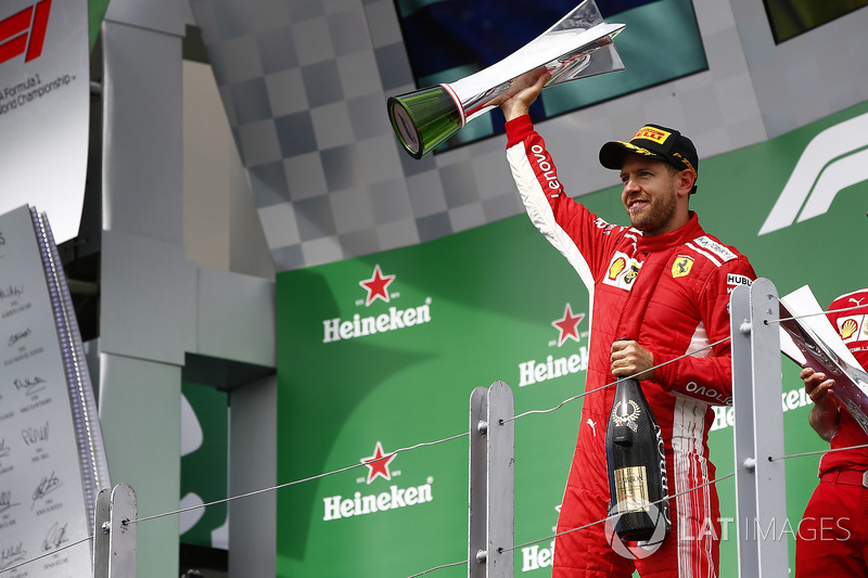 Sebastian Vettel, Ferrari, 1st position, celebrates on the podium