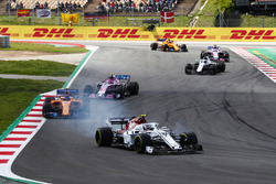 Charles Leclerc, Sauber C37, Fernando Alonso, McLaren MCL33 and Esteban Ocon, Force India VJM11