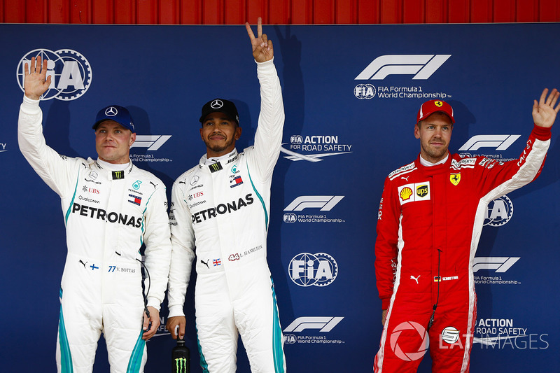 Lewis Hamilton, Mercedes AMG F1, celebrates pole position with Valtteri Bottas, Mercedes AMG F1, and Sebastian Vettel, Ferrari