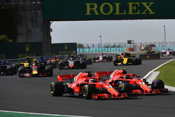 Sebastian Vettel, Ferrari SF71H and Kimi Raikkonen, Ferrari SF71H battle at the start of the race