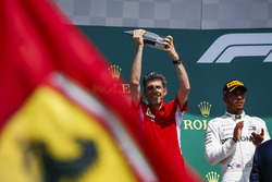 Claudio Albertini, Ferrari, receives the Constructors Trophy for Ferrari on the podium