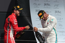 Sebastian Vettel, Ferrari and Lewis Hamilton, Mercedes-AMG F1 on the podium