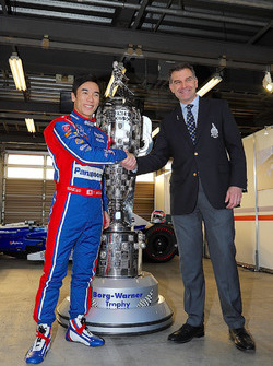 Indy 500 winner Takuma Sato, Andretti Autosport with the Borg-Warner Trophy and Scott Gallett, VP of marketing at BorgWarner Inc.