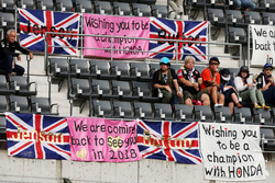 Fans in the grandstand and banners for Jenson Button, McLaren