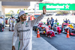 Lewis Hamilton, Mercedes AMG F1, waves to the fans after taking Pole Position