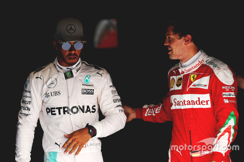 (L to R): Pole sitter Lewis Hamilton, Mercedes AMG F1 with third placed Sebastian Vettel, Ferrari in