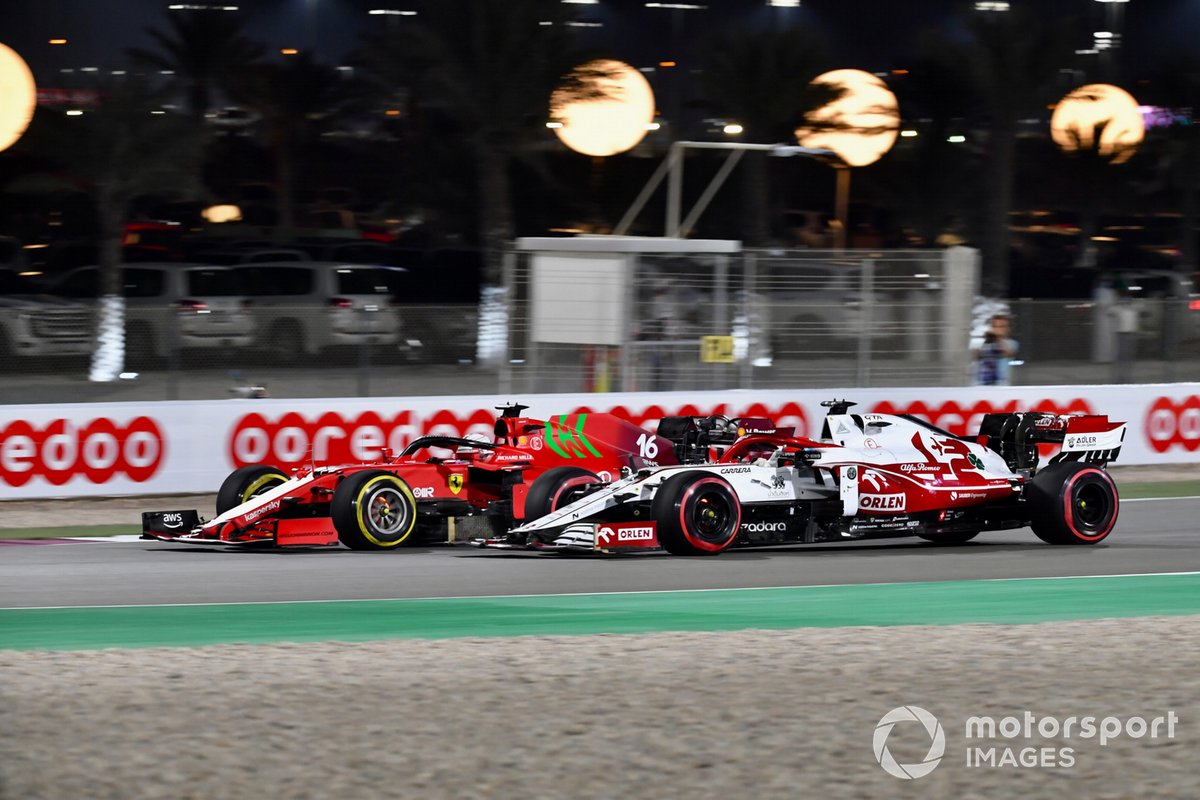 Charles Leclerc, Ferrari SF21, battles with Kimi Raikkonen, Alfa Romeo Racing C41