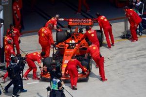 Sebastian Vettel, Ferrari SF90, is returned to the garage