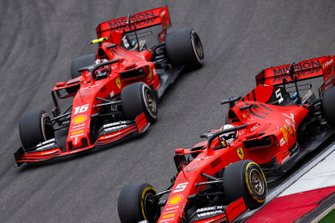 Sebastian Vettel, Ferrari SF90, leads Charles Leclerc, Ferrari SF90