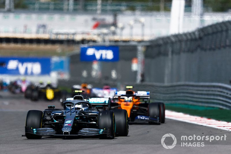 Valtteri Bottas, Mercedes AMG W10, leads Lando Norris, McLaren MCL34