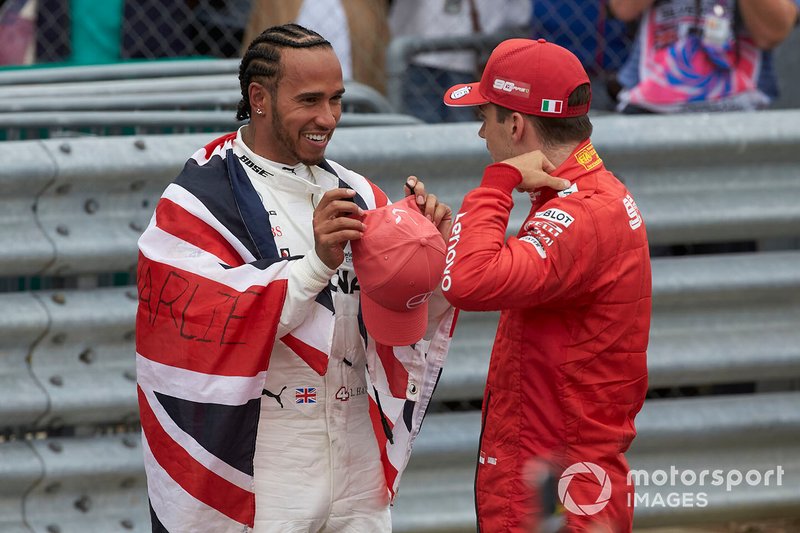 Lewis Hamilton, Mercedes AMG F1, 1st position, talks with Charles Leclerc, Ferrari, 3rd position, in Parc Ferme