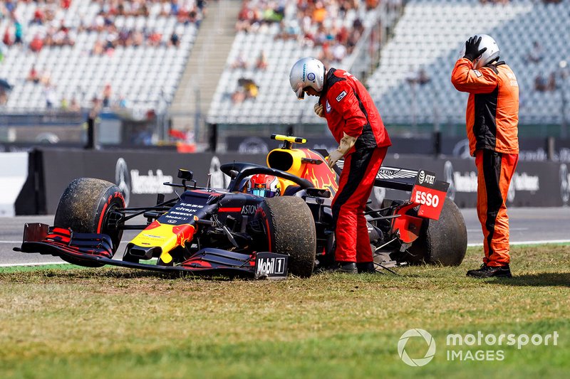 Marshals assists Pierre Gasly, Red Bull Racing RB15, after a crash