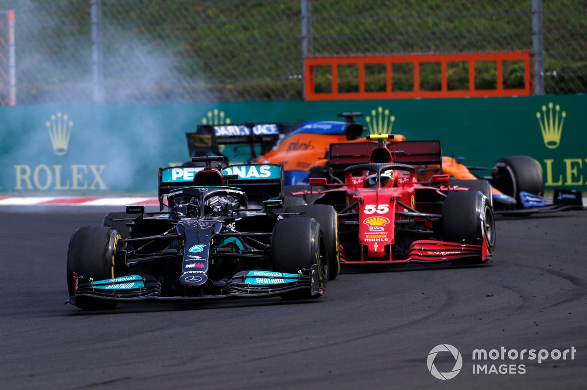 Lewis Hamilton, Mercedes W12, passes Carlos Sainz Jr., Ferrari SF21