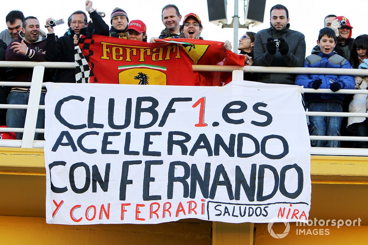 Fernando Alonso Ferrari banner and fans.