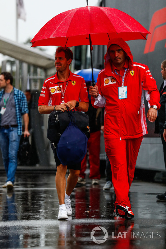 Sebastian Vettel, Ferrari, arrives in the paddock
