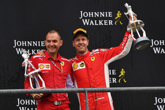 Sebastian Vettel, Ferrari and David Sanchez, Ferrari, celebrates on the podium with the trophies