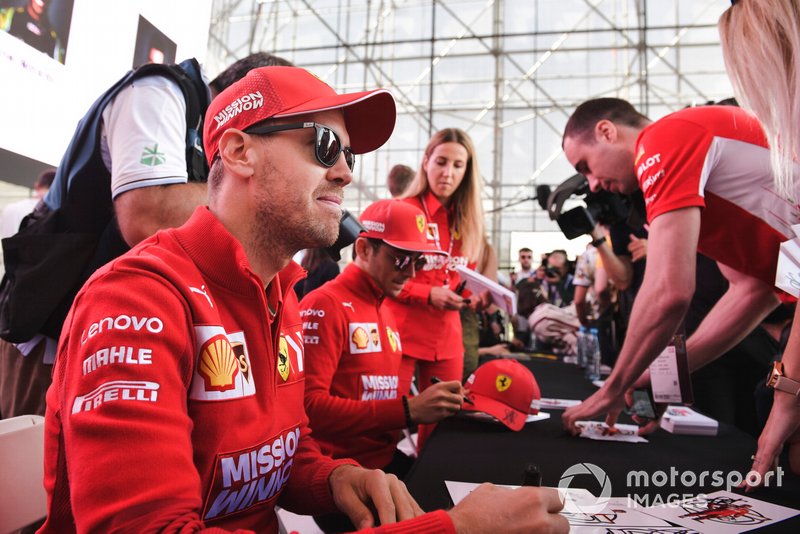 Sebastian Vettel, Ferrari and Charles Leclerc, Ferrari sign autographs for fans