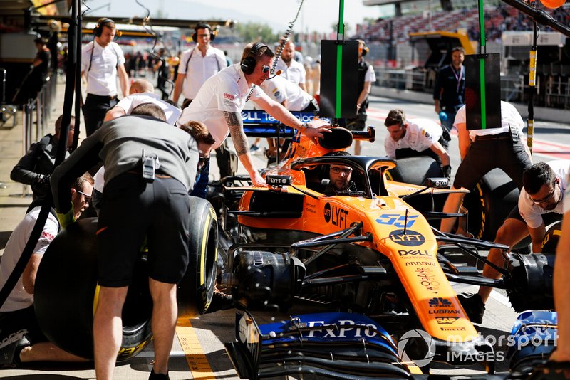 The McLaren team practice their pit stop drill