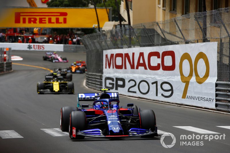 Alexander Albon, Toro Rosso STR14, leads Nico Hulkenberg, Renault R.S. 19, and Romain Grosjean, Haas F1 Team VF-19