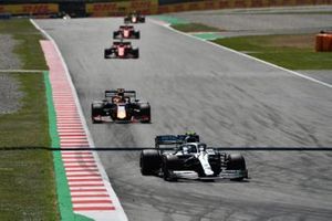 Valtteri Bottas, Mercedes AMG W10, leads Max Verstappen, Red Bull Racing RB15