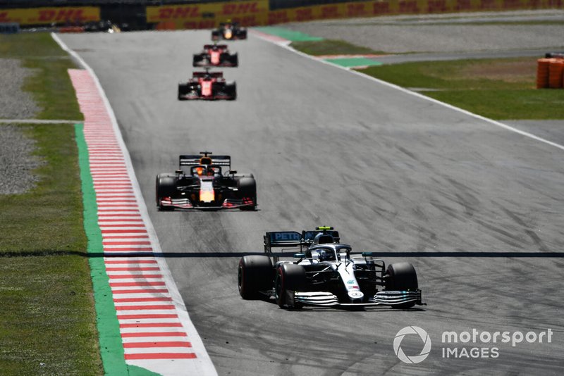 Valtteri Bottas, Mercedes AMG W10, leads Max Verstappen, Red Bull Racing RB15