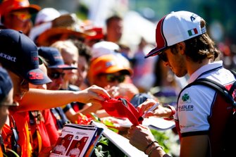 Antonio Giovinazzi, Alfa Romeo Racing signs a autograph for a fan