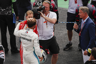 Title rival Sebastian Vettel, Ferrari, offers his congratulations to drivers championship winner Lewis Hamilton, Mercedes AMG F1