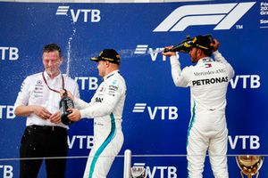 Race winner Lewis Hamilton, Mercedes AMG F1, sprays Champagne at second place Valtteri Bottas, Mercedes AMG F1, and James Allison, Technical Director, Mercedes AMG