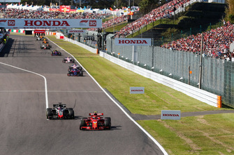 Kimi Raikkonen, Ferrari SF71H, leads Romain Grosjean, Haas F1 Team VF-18, Pierre Gasly, Scuderia Toro Rosso STR13, and Sergio Perez, Racing Point Force India VJM11