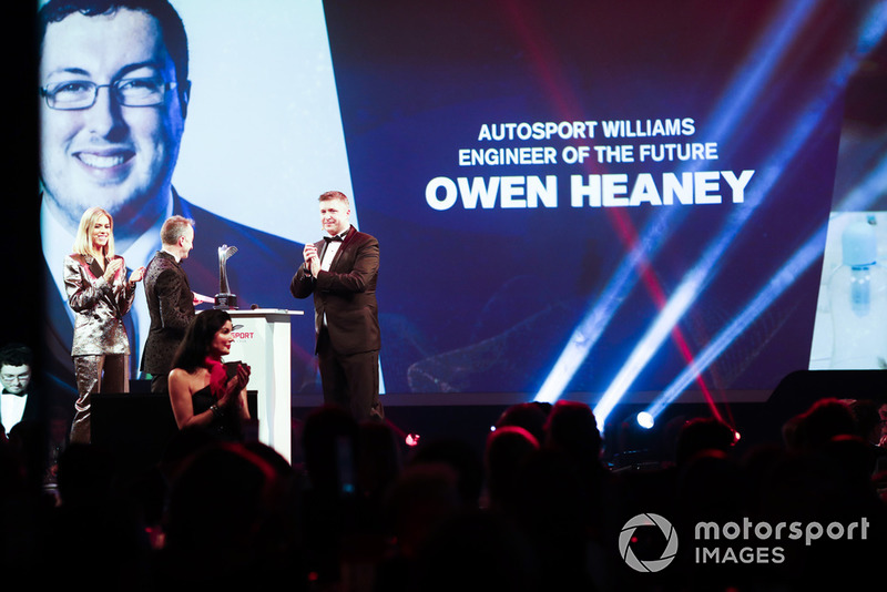 Nicki Shields and David Croft on stage with Paddy Lowe to present the Autosport Williams Engineer of the Future Award to Owen Heaney