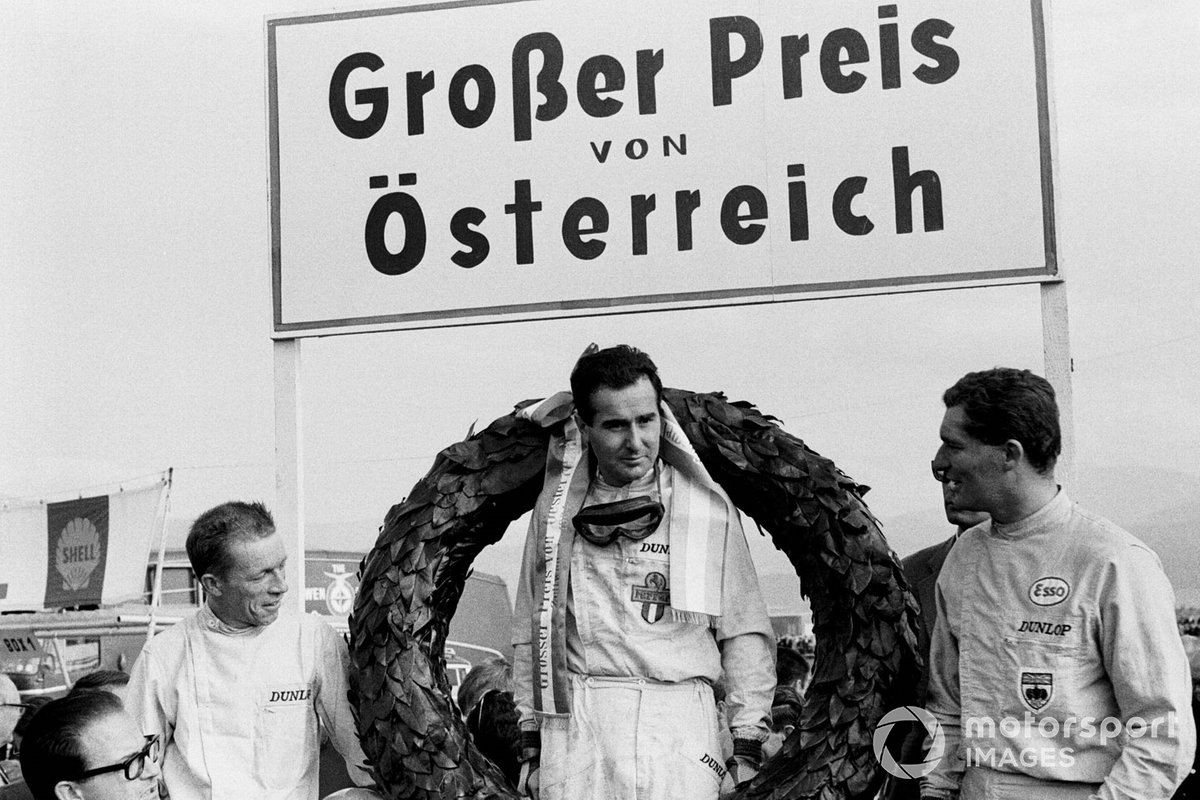 Podium: winner Lorenzo Bandini Ferrari, second place Richie Ginther, BRM, and third place Bob Anderson, Brabham