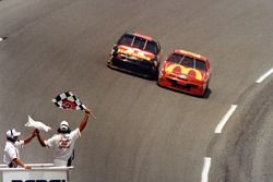 Jimmy Spencer takes the checkred flag ahead of Ernie Irvan