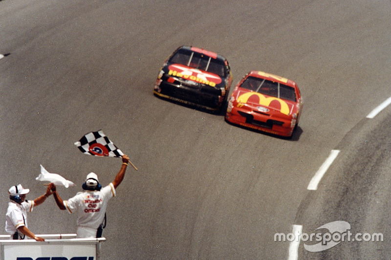 Jimmy Spencer takes the checkred flag ahead of Ernie Irvan