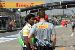 Karun Chandhok, Channel 4 Technical Analyst talks with a Pirelli engineer