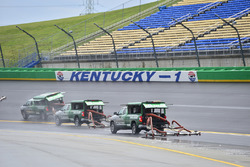 Track workers attempt to dry the track