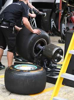 Mercedes AMG F1 mechanic and Pirelli tyre