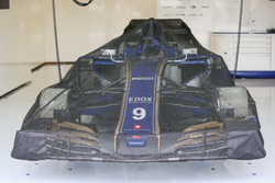 Sauber C36 under covers in the garage