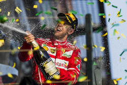 Sebastian Vettel, Ferrari, 1st Position, sprays Champagne on the podium
