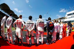 The drivers stand to attention for the national anthem. L-R: paul di Resta, Lance Stroll, Williams, Kevin Magnussen, Haas F1 Team, Sergio Perez, Force India, Esteban Ocon, Force India, Carlos Sainz Jr., Scuderia Toro Rosso, Fernando Alonso, McLaren, Daniil Kvyat, Scuderia Toro Rosso, Valtteri Bottas, Mercedes AMG F1 and Sebastian Vettel, Ferrari