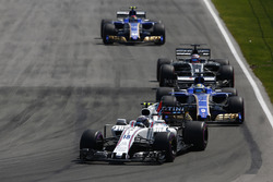 Lance Stroll, Williams FW40, Marcus Ericsson, Sauber C36, Romain Grosjean, Haas F1 Team VF-17