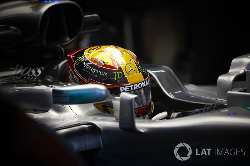 Lewis Hamilton, Mercedes AMG F1 W08, sits in the cockpit of his car in the garage